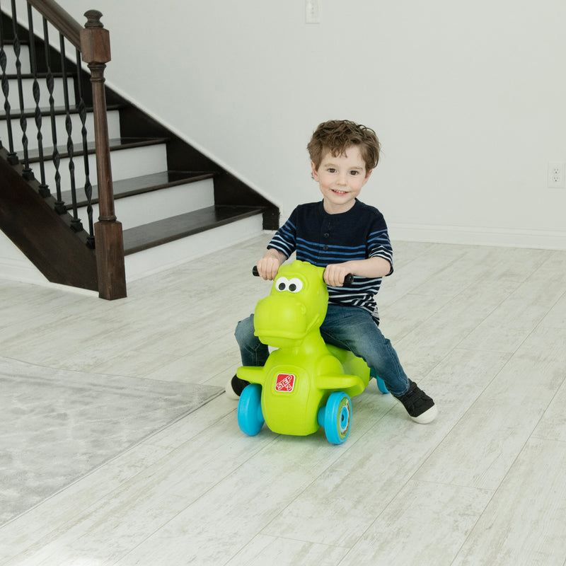 Dino Dash Foot-to-Floor Ride-On with child riding indoors