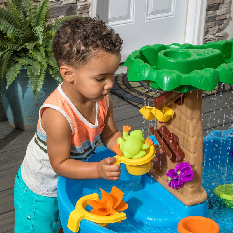 Tropical Rainforest Water Table boy playing with accessories <br />