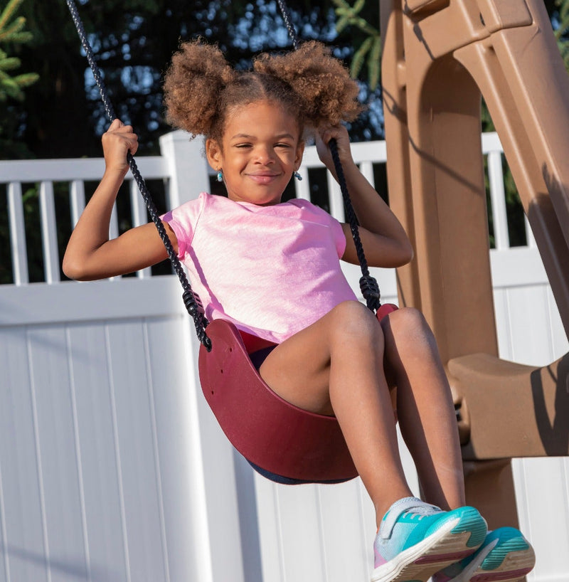 Naturally Playful™ Playhouse Climber & Swing Extension girl swinging