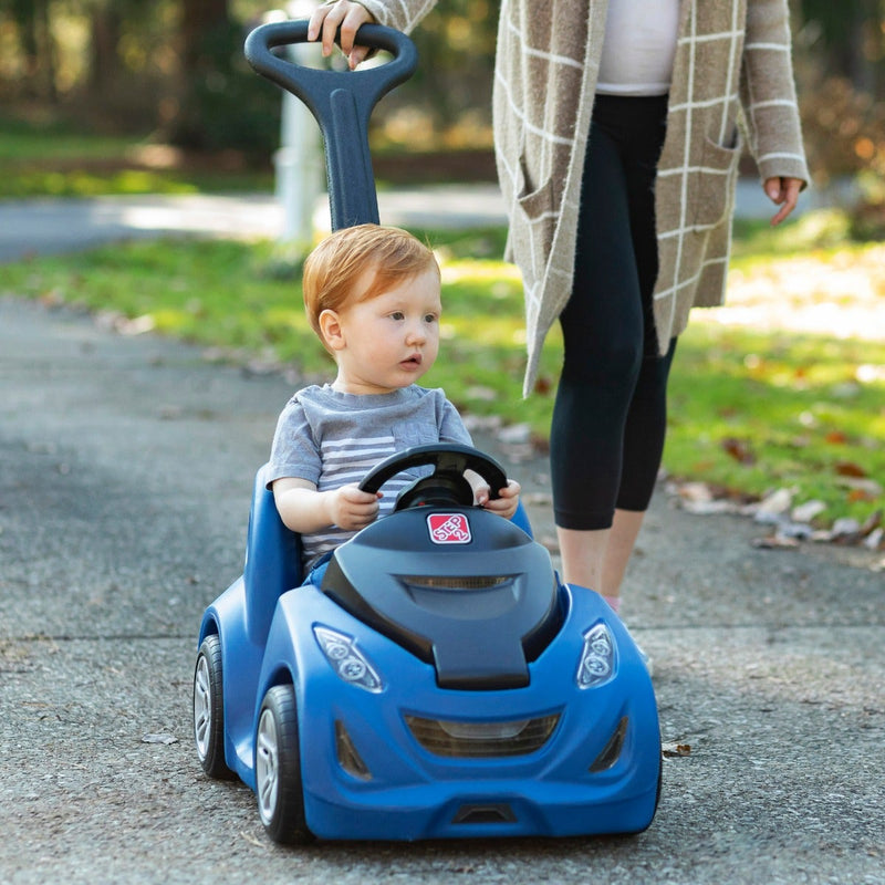 Push Around Buggy GT™ Blue with boy being pushed in push car
