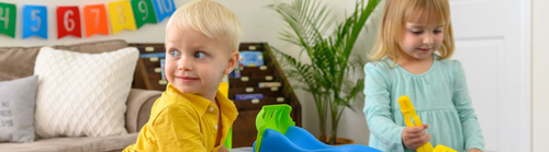 Toddlers playing with play table
