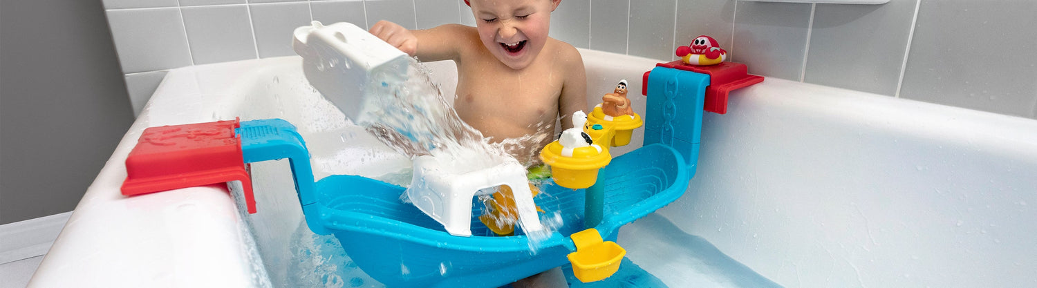 boy playing in bath tub