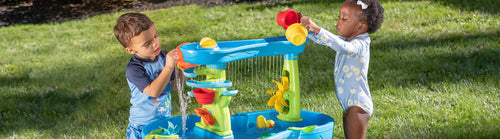 Playing with a Step2 water table for kids