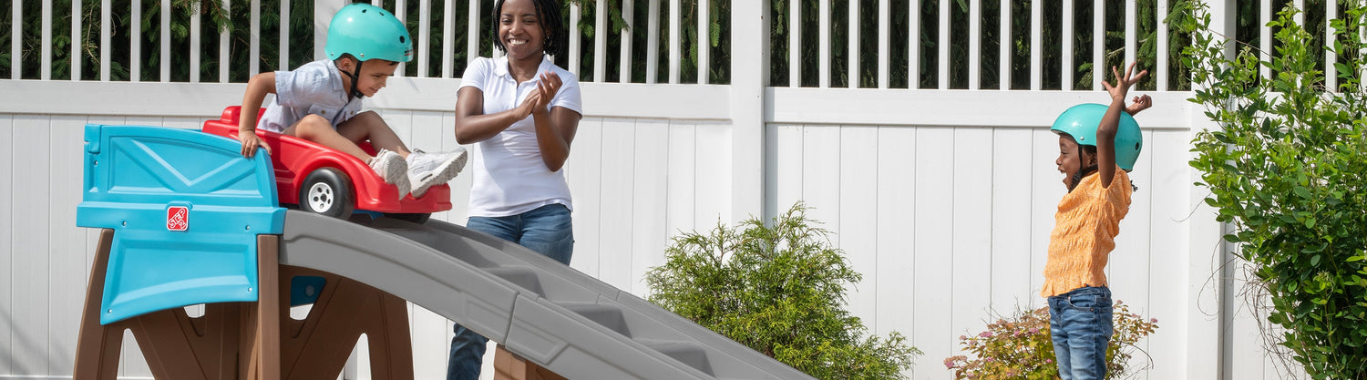 Family playing with the Step2 Extreme Coaster kids roller coaster