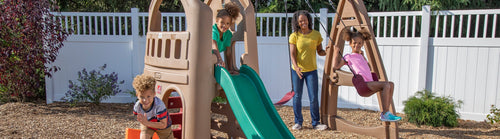 kids playing on a swing set