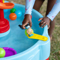 Spiral Slide Water Table™ side flipper being used with figurine