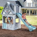 Enchanting Adventures 2-Story Playhouse & Slide outdoors