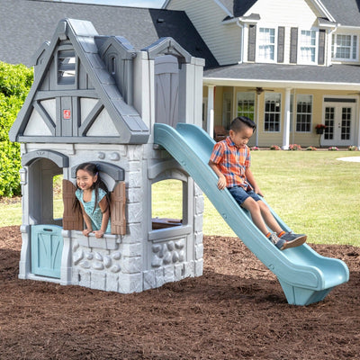 Enchanting Adventures 2-Story Playhouse & Slide outdoors