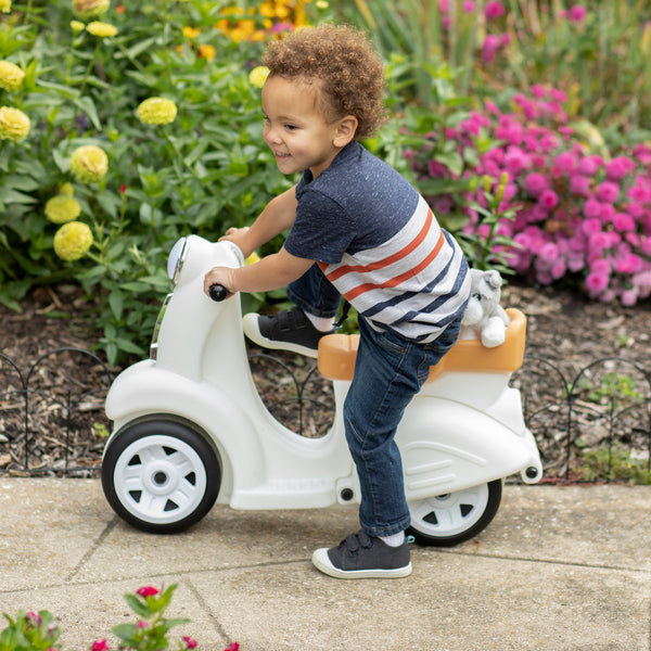 Ride Along Scooter™ - White with child getting on scooter