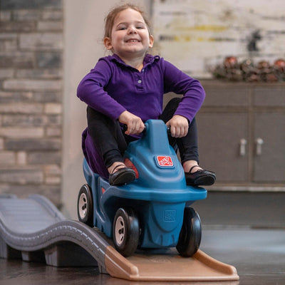  Up & Down Roller Coaster Platinum Edition girl riding with feet up.