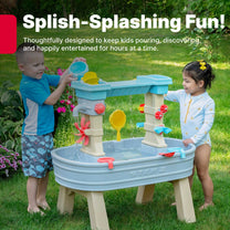 Rain Showers & Flow Water Table™ lifestyle view, two children playing together at the dual-level water table in backyard garden