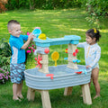 Rain Showers & Flow Water Table with kids playing outdoors