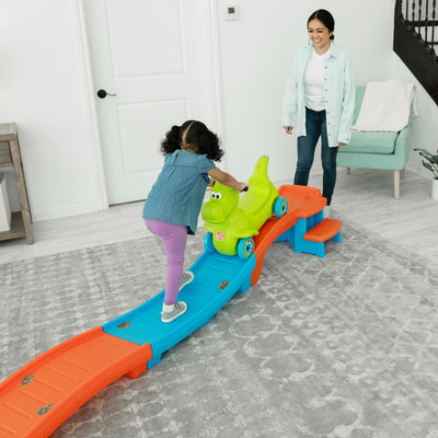 Dino Dash Up &  Down Roller Coaster with child pushing coaster car up track