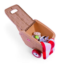 Overhead view of open My First Picnic Basket with toy food accessories and red-and-white checkered blanket packed inside; white background