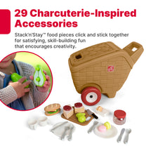 29 Charcuterie-Inspired Accessories — Stack'n'Stay food pieces click and stick together; inset of child snapping toy avocado halves; My First Picnic Basket and accessories on white background