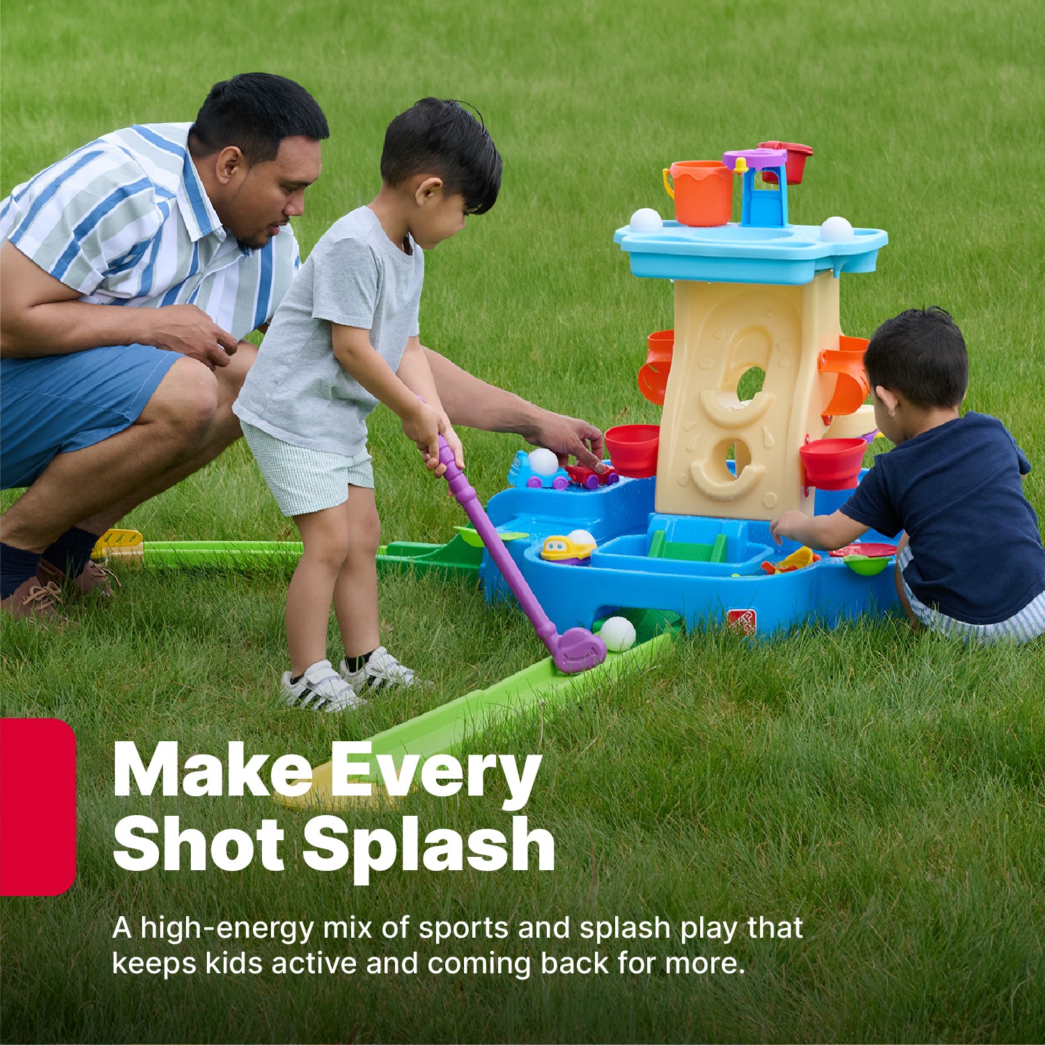 Make Every Shot Splash — dad kneeling beside two young boys playing Putt-Splash Adventure Center on grass; one boy putting toward central tower; "A high-energy mix of sports and splash play that keeps kids active"