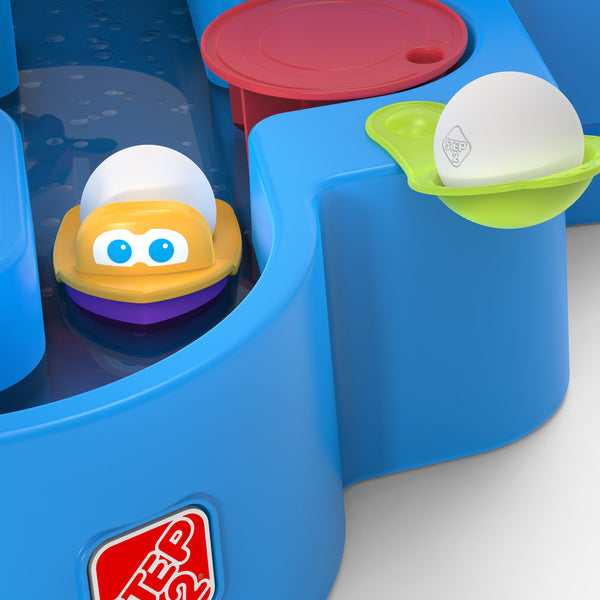 Close-up view of the Step2 kids multi color Putt & Splash Adventure Center ball holder & ball holder floating boat accessory