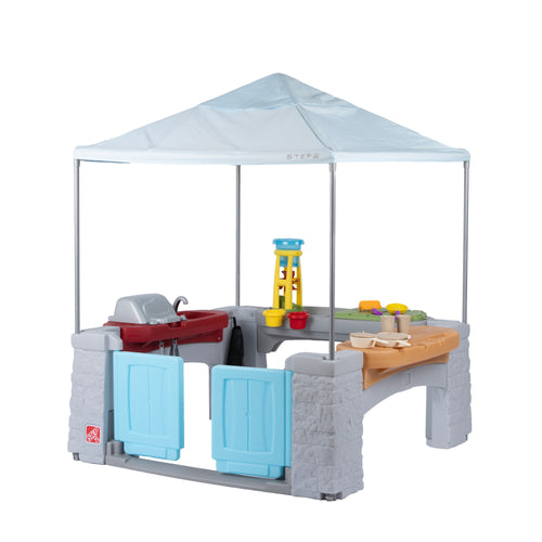 Step2 All Around Play Pavilion with white canopy, outdoor kitchen grill, water play tower, and sand table, white background