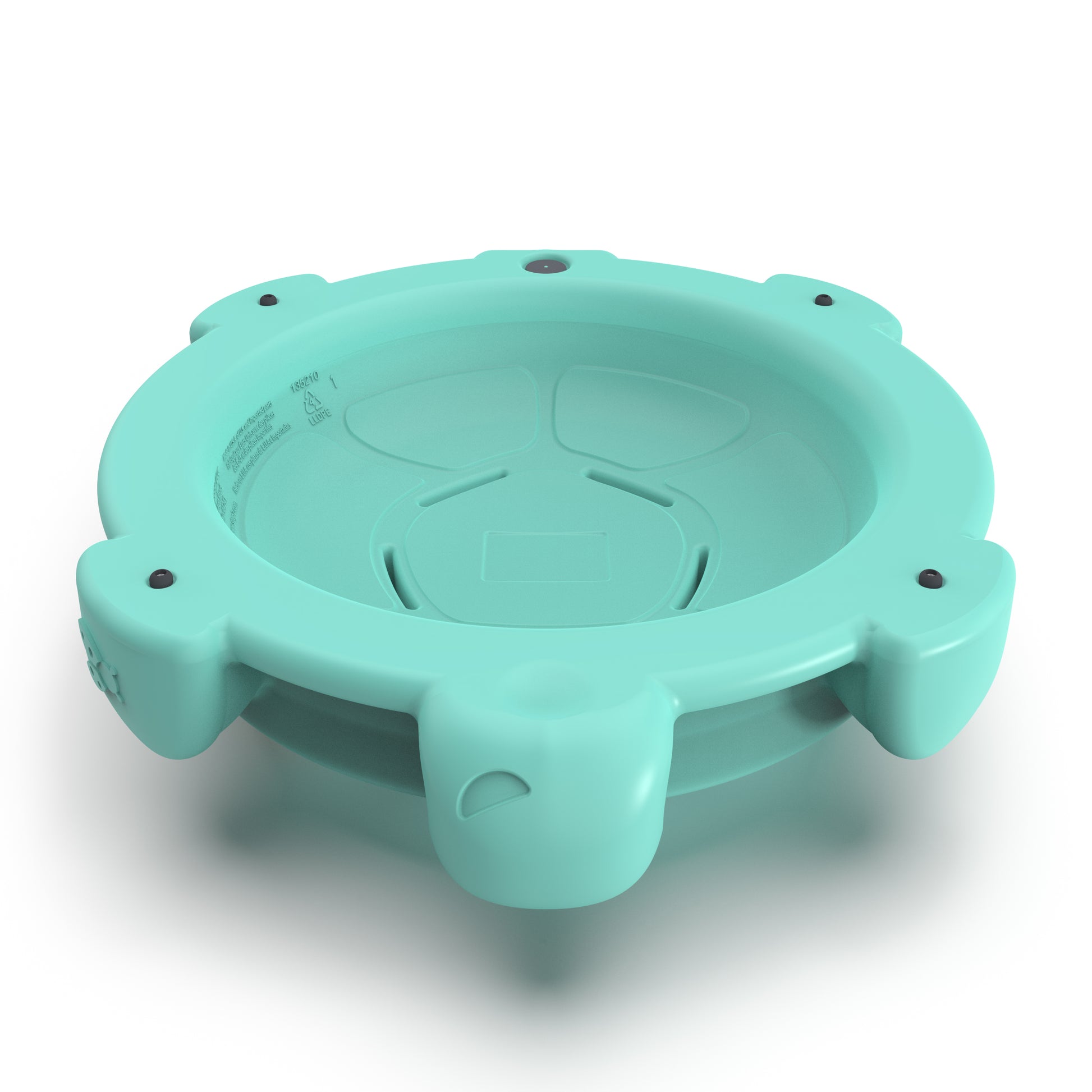 Underside view of Topsy Turtle teal rocking disk showing concave sitting bowl, rubber feet bumps around edge, and product molding, on white background