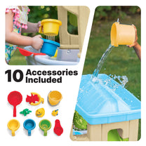 "10 Accessories Included" — Rain Showers Splash Station Water Table™ being enjoyed by girl pouring water into upper rain tray while boy holds yellow cup at basin level; inset shows all 10 included accessories