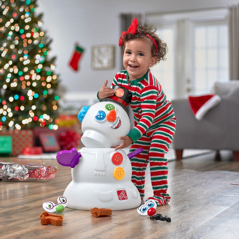My First Christmas Tree girl playing with snowman