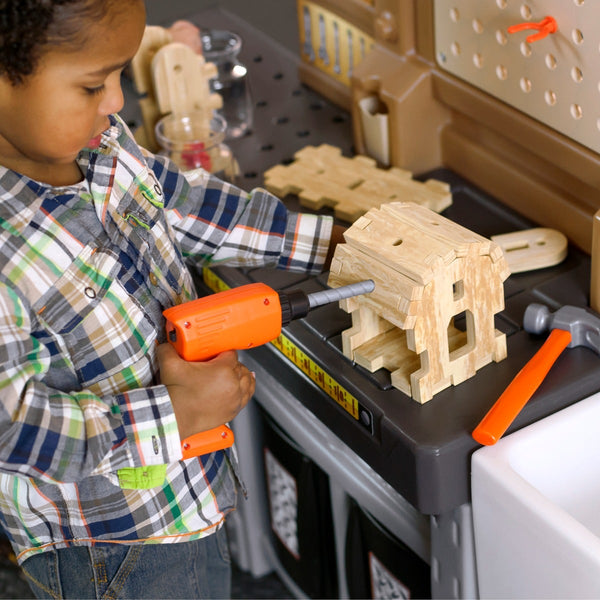 Pro Play Workshop and Utility Bench boy with drill.