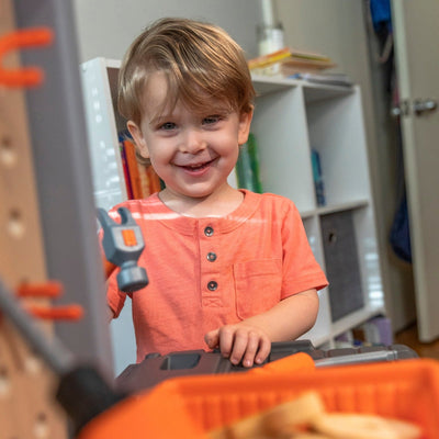 Handyman Workbench™ - Orange boy playing with hammer