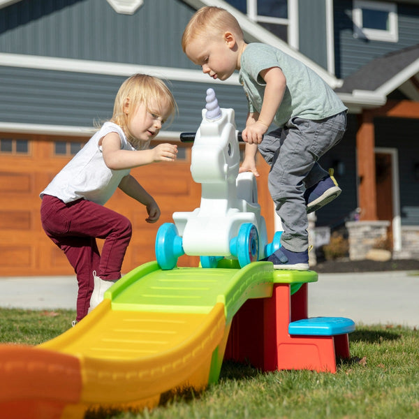 Unicorn Up & Down Roller Coaster™ boy on step
