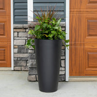 Tremont Tall  Round Tapered Planter - Onyx Black with foliage.