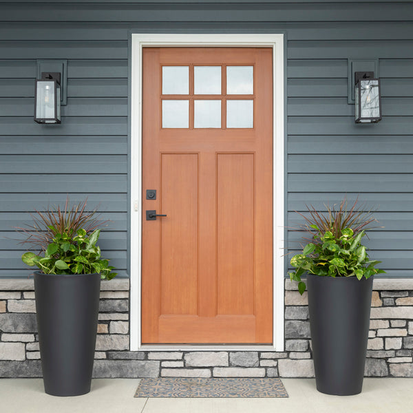 Tremont Tall Round Tapered Planter™ - Onyx Black 2 Pack at entryway