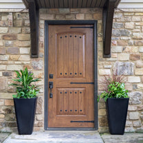 Bridgeview Tall Planter displayed on either side of a front door.
