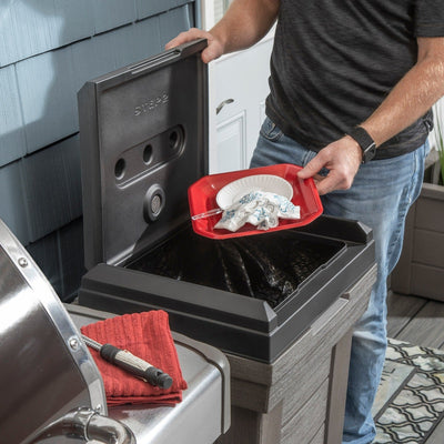 Lakewood Trash Container™ man putting trash in can.