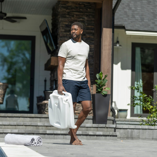 Flip Seat™ man carrying using built in handle