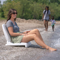 Flip Seat™ seated at edge of water