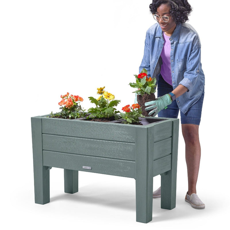 Lakewood Planter Box - Sage Gray woman planting flowers.