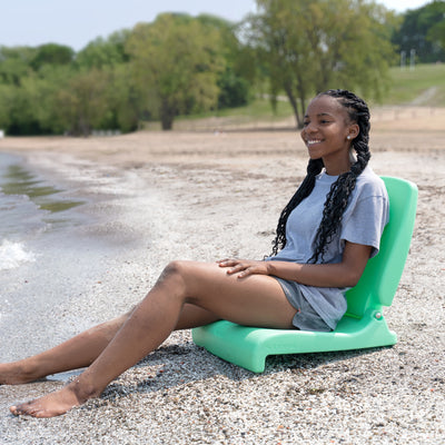 Flip Seat™ girl seated at beach