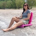 Flip Seat™ woman seated at beach