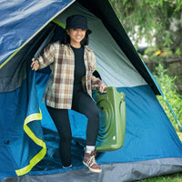 Flip Seat-Olive Green women carrying folded seat while camping.