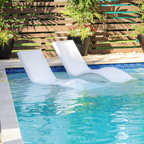 Vero Pool Lounger empty loungers in the water