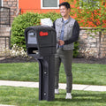 Mailmaster Plus Mailbox™ - Black with man retrieving mail from rear door 