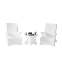 Vero In Pool Accent Table™ flanked by two white Vero Adirondack chairs on white background — drinks, sunglasses, and magazine on tabletop; full Vero Collection styling scene