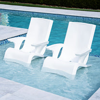 Step2 Vero Adirondack Chair 2 Pack — two white chairs in a blue mosaic tile pool with stone coping