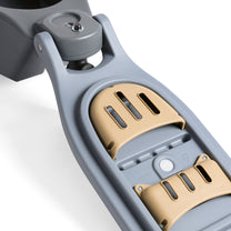 Close-up of EverTough Garden Hopper front underside corner showing amber tool hook hardware and caster wheel assembly, on white background