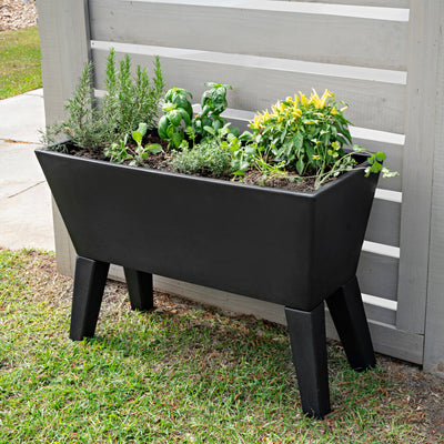 Tremont Raised Planter™ with foliage