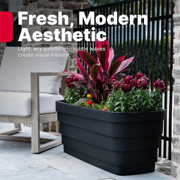 Wave Trough Planter™ 2 Pack - Black single planter shown on patio
