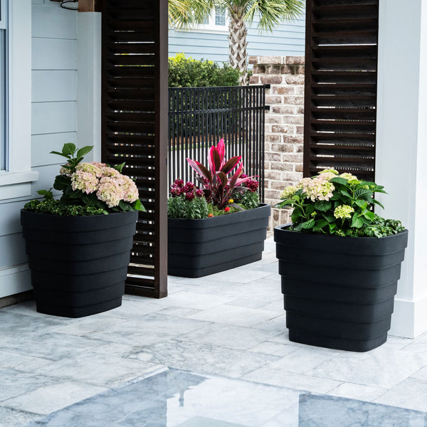 Wave Planter™ 20X24 2 Pack - Black shown on patio