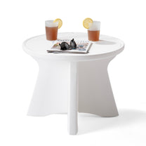 Vero In Pool Accent Table™ styled with two drinks with lemon slices, sunglasses, and a magazine on the round tabletop; shows built-in raised ring edge and four-panel base on white background