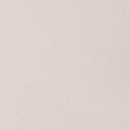 Close-up of a beige ceramic tile with a speckled texture on a white background