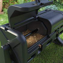 Close-up of EverTough Composter interior chamber showing compost material and axle rod