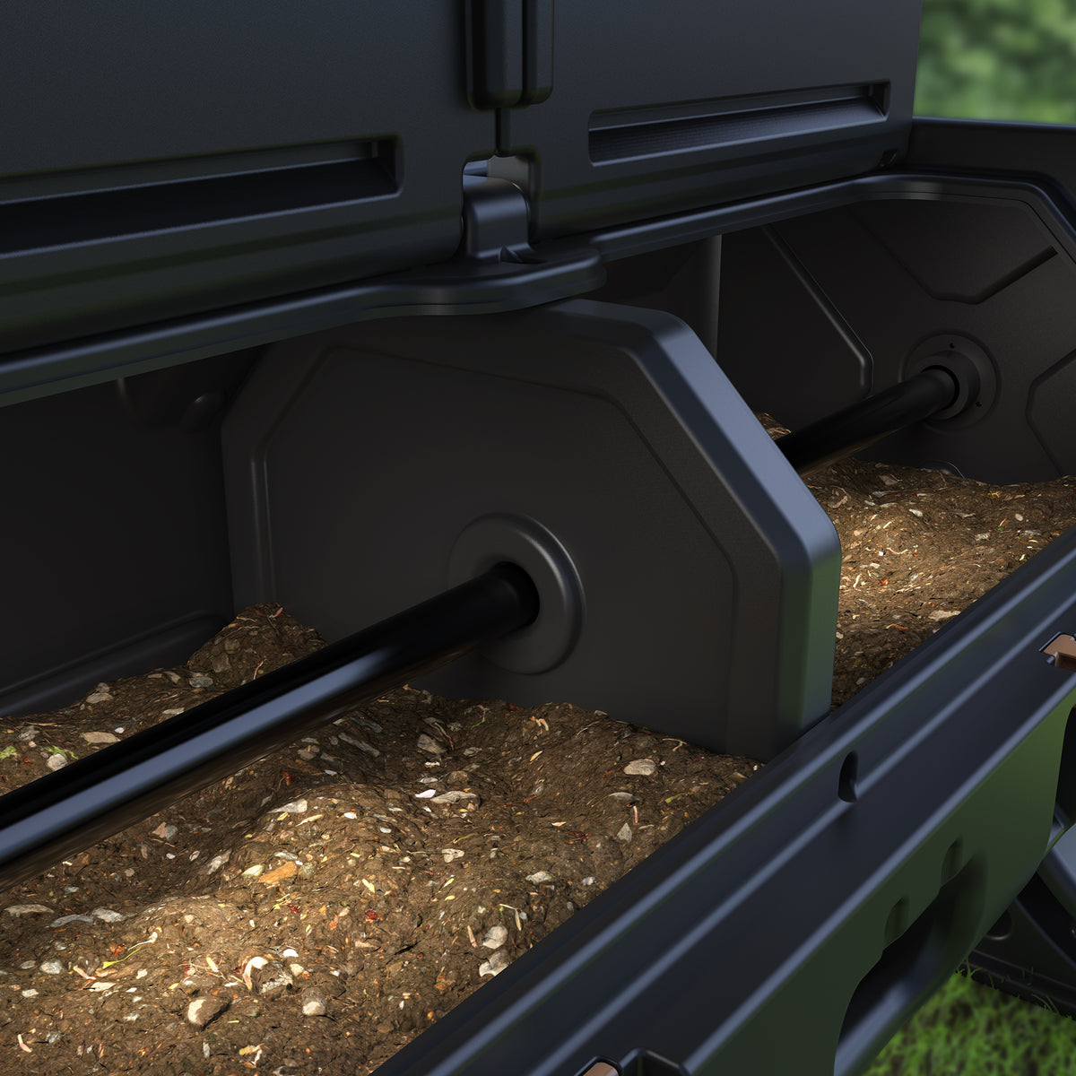 Close-up of EverTough Composter dual chambers with central divider and compost inside